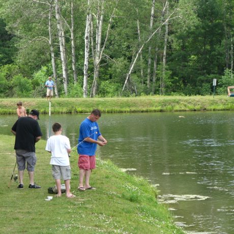 people fishing in the pond at Sparrow Pond Family Campground