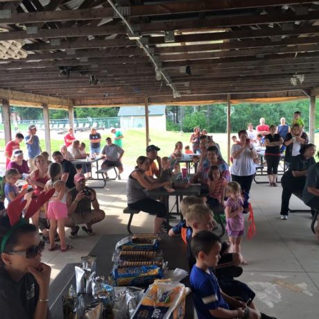 group of people enjoying a party in the pavilion at Sparrow Pond Family Campground